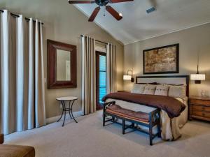 a bedroom with a bed and a ceiling fan at Southern Grounds in Santa Rosa Beach +35 photos