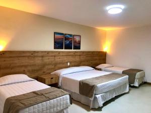 Postel nebo postele na pokoji v ubytování Brisa da Praia Park Hotel
