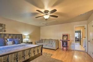 a bedroom with a bed and a ceiling fan at San Antonio Oasis with Hot Tub, Pool and Outdoor Bar! in San Antonio