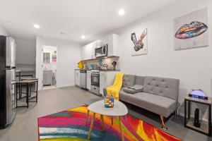 a living room with a couch and a table at Private Studio Apartment Near NYC in Hoboken