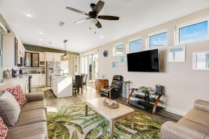 a living room with a couch and a table at Big Pine Key Dreams in Big Pine Key