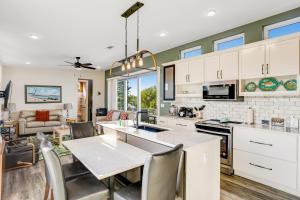 a kitchen and living room with a table and chairs at Big Pine Key Dreams in Big Pine Key