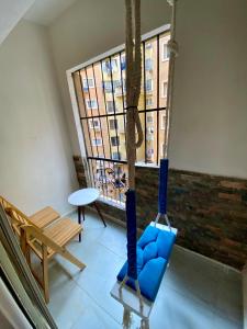 a swing in a room with a window at Cozy 2BR Apartment in Maadi in Cairo