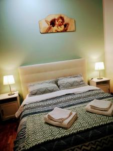 Un pat sau paturi într-o cameră la Firenze inn 21 Florence