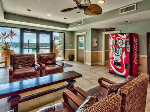 a living room with a coca cola machine at Origin at Seahaven in Panama City Beach