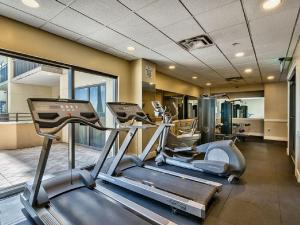 a gym with two treadmills and a treadmill at Origin at Seahaven in Panama City Beach