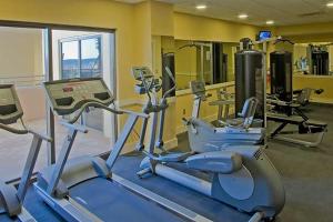 a gym with several exercise bikes in a room at Origin at Seahaven in Panama City Beach