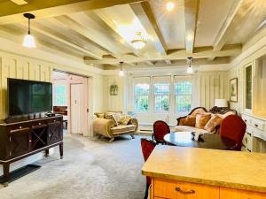 a living room with a tv and a couch at Parlor Suite in Heritage Manor, Fairfield, near DT in Victoria