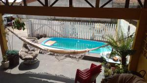 an overhead view of a hammock and a swimming pool at Brisa do Mar Guaratuba in Guaratuba