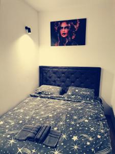 a bed with christmas lights on top of it at Belvedere Zlatibor LUX & SPA Apartment in Zlatibor