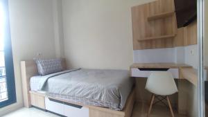 Postel nebo postele na pokoji v ubytování Shofa boarding house syariah