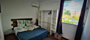 Postel nebo postele na pokoji v ubytování TITIRI Appartement