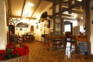 a kitchen and dining room with tables and chairs at Holiday home in Medelby in Medelby