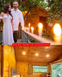 a man and a woman standing on a balcony at Spice Villa Thekkady in Thekkady