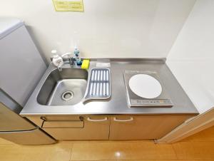 a bathroom with a sink and a mirror at Amber Iidabashi - Vacation STAY 89682v in Tokyo