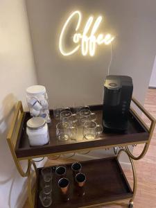 a table with glasses and a coffee machine on it at 3BR 2min from I-40,near DT, 21 min Palo Duro in Amarillo