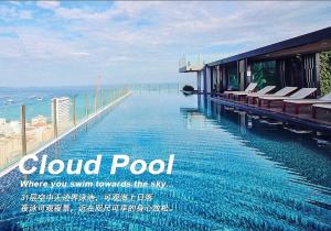 a picture of a swimming pool at a resort at THE BASE Seaview holiday inn in Pattaya Central