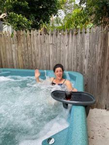 a woman is in a jacuzzi in a pool at Nearly new 2 bedrooms private entire unit in Slacks Creek