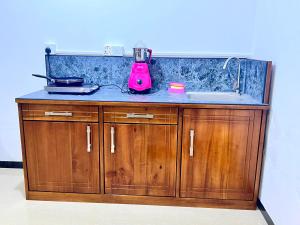 a kitchen counter with a blender and a sink at Mangrove Bay Inn in Weligama