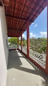 a balcony with a view of the ocean at Recanto ViVa - Catuama in Goiana