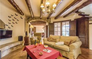 a living room with a couch and a table at Gorgeous Home In Begur With Kitchen in Begur