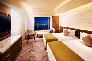 Postel nebo postele na pokoji v ubytování InterContinental Tokyo Bay by IHG + 37 fotografií