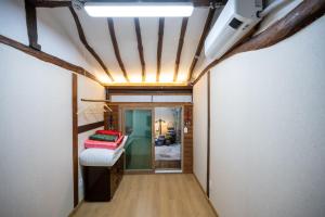 Postel nebo postele na pokoji v ubytování Hanok1942