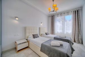Łóżko lub łóżka w pokoju w obiekcie REF 1477 - Apartment for rent
