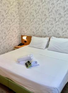 Postel nebo postele na pokoji v ubytování Hotel Embassy