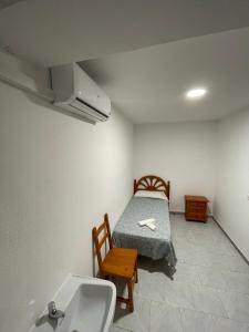 Cama o camas de una habitación en Hostal La Campiña