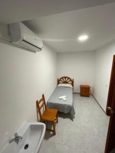 Cama o camas de una habitación en Hostal La Campiña