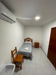 Cama o camas de una habitación en Hostal La Campiña