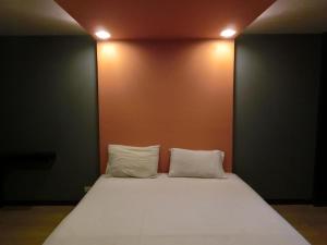 Ένα ή περισσότερα κρεβάτια σε δωμάτιο στο NewYork Suite Hotel
