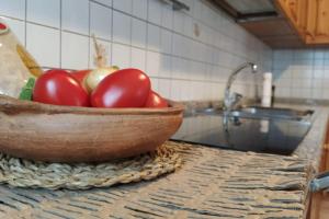 O bucătărie sau chicinetă la Cà dei Zoani casa vacanze 022139 AT 722787 +40 fotografii