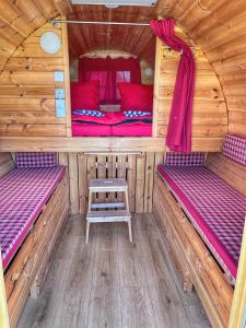 a inside of a cabin with two beds and a table at Beck's Borveranda Palkonya in Palkonya