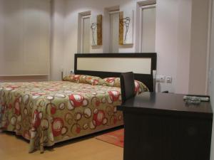 Posteľ alebo postele v izbe v ubytovaní Hotel Elizalde