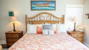 a bedroom with a large bed with pillows at Dolphin House in Santa Rosa Beach +52 photos