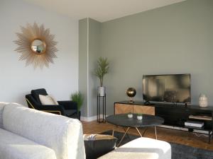 Televízia a/alebo spoločenská miestnosť v ubytovaní Appartement Le Céleste 113 - deux chambres