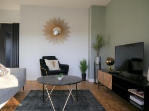 Televízia a/alebo spoločenská miestnosť v ubytovaní Appartement Le Céleste 113 - deux chambres