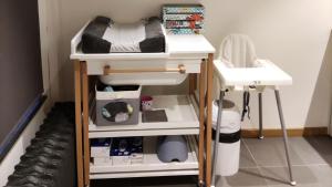 a bedroom with a bunk bed and a sink at La Cense du Noir Jambon in Silly
