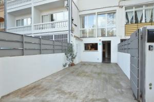 an empty hallway of a building with white walls and windows at House 200m from Puerto de Sóller Beach in Sóller