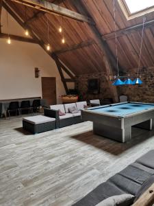 a large room with a pool table in it at Domaine des Maillets in Blot-lʼÉglise +25 photos