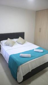Postel nebo postele na pokoji v ubytování Encantador y Cómodo apartamento en condominio