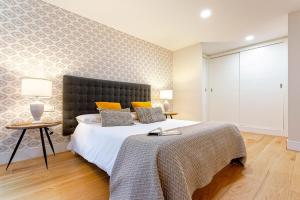 Posteľ alebo postele v izbe v ubytovaní Genteel Home San Agustín