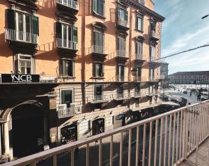 a tall building with balconies on the side of it at Pagina Storica di Napoli in Naples