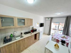 a kitchen with a sink and a counter top at Central Comfort Studio in Larnaca
