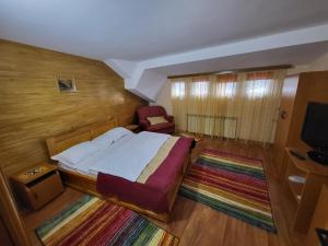 Postel nebo postele na pokoji v ubytování Vila Maya Predeal