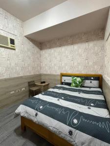 Een bed of bedden in een kamer bij 77窩House