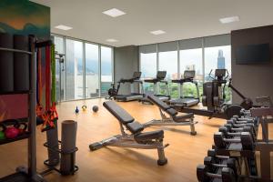 a gym with treadmills and elliptical machines at Hyatt Place Monterrey Valle in Monterrey