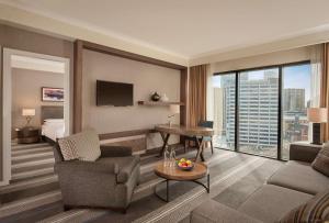 a living room with a couch and a table in a hotel room at Hyatt Regency Birmingham in Birmingham